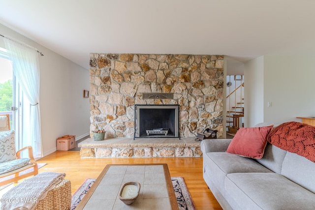 113 Jacobs Ladder Rd, Starrucca, PA 18462 - living area featuring stairs, wood finished floors, and a stone fireplace
