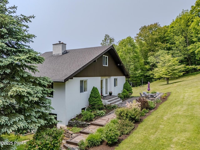 113 Jacobs Ladder Rd, Starrucca, PA 18462 - view of front of property with roof with shingles, a front yard, a chimney, and stucco siding