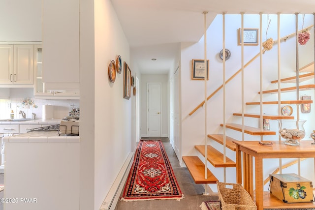 113 Jacobs Ladder Rd, Starrucca, PA 18462 - corridor featuring a baseboard radiator and stairway
