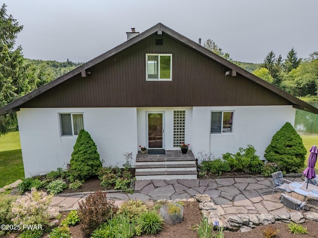 113 Jacobs Ladder Rd, Starrucca, PA 18462 - rear view of property featuring a patio and a chimney
