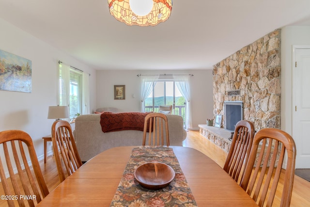113 Jacobs Ladder Rd, Starrucca, PA 18462 - dining room featuring light wood-style floors and a stone fireplace