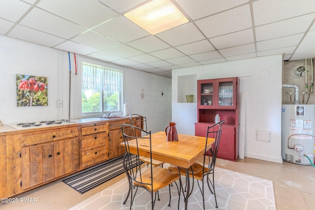 113 Jacobs Ladder Rd, Starrucca, PA 18462 - dining room featuring gas water heater, a drop ceiling, and concrete floors