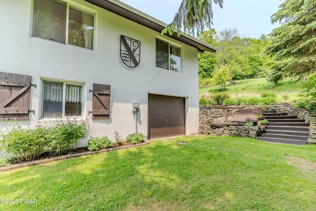 113 Jacobs Ladder Rd, Starrucca, PA 18462 - view of front facade with stucco siding, an attached garage, and a front yard