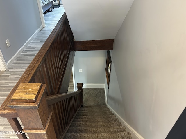 stairs featuring baseboards