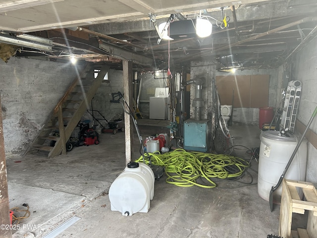 unfinished basement featuring washer / dryer