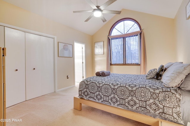 bedroom featuring a closet, vaulted ceiling, ceiling fan, and carpet floors