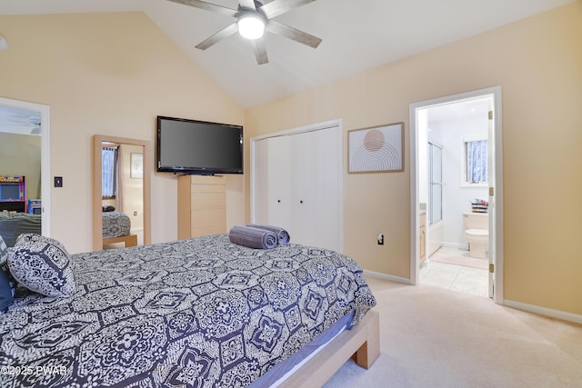 bedroom featuring high vaulted ceiling, baseboards, a closet, and light carpet