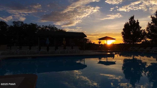 outdoor pool featuring a water view