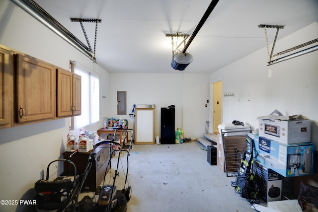 garage featuring electric panel and a garage door opener