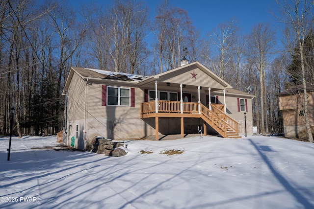 view of front facade with covered porch and stairs