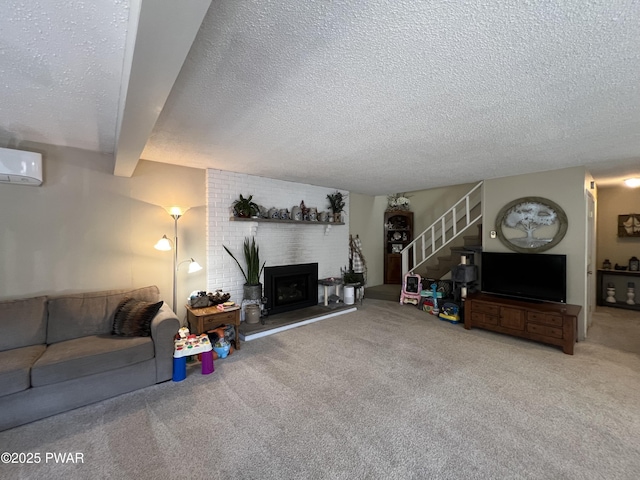 carpeted living area featuring a brick fireplace, stairs, beam ceiling, a textured ceiling, and a wall mounted AC