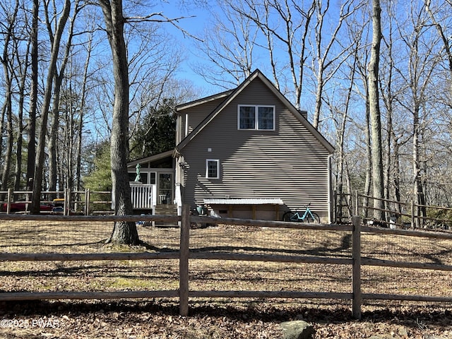 view of home's exterior featuring fence