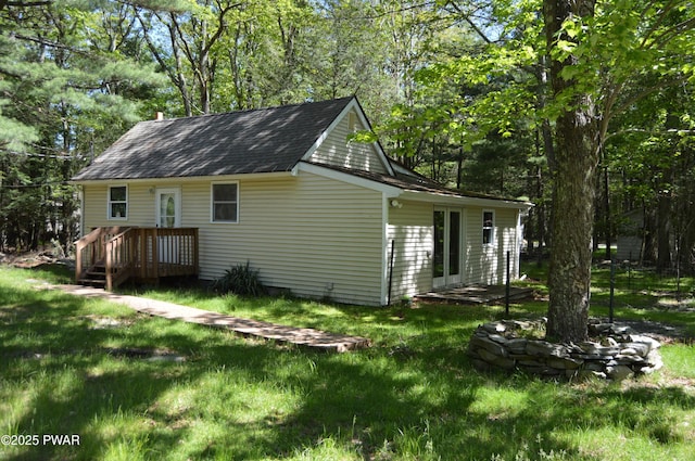 140 Algonquin Rd, Shohola, PA 18458 - view of property exterior featuring a yard and roof with shingles