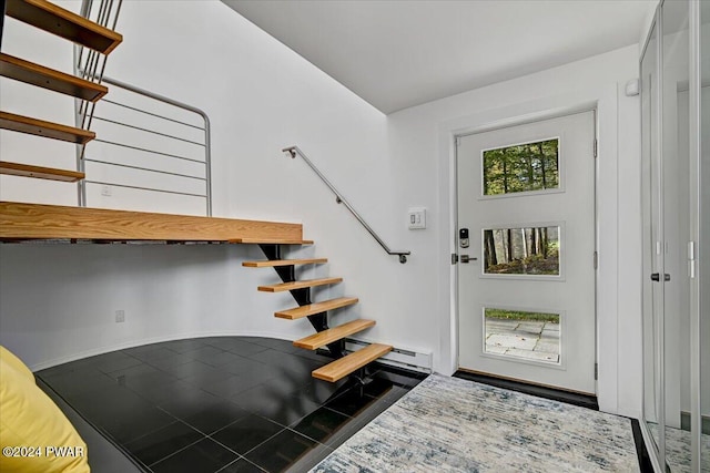 foyer entrance with a baseboard radiator