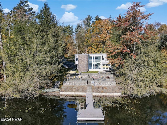 rear view of property featuring a water view