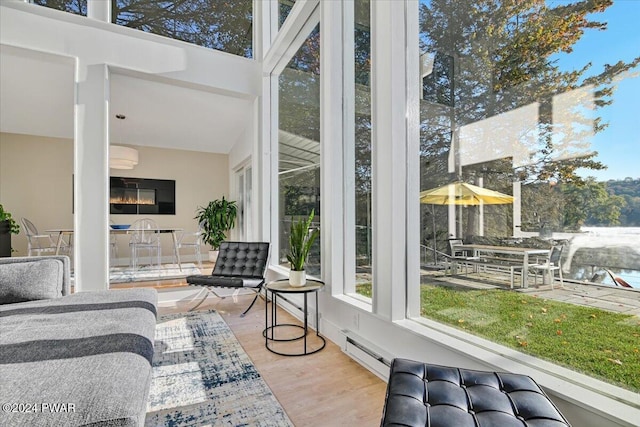 sunroom featuring a baseboard radiator