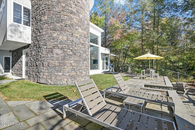 wooden terrace with a patio