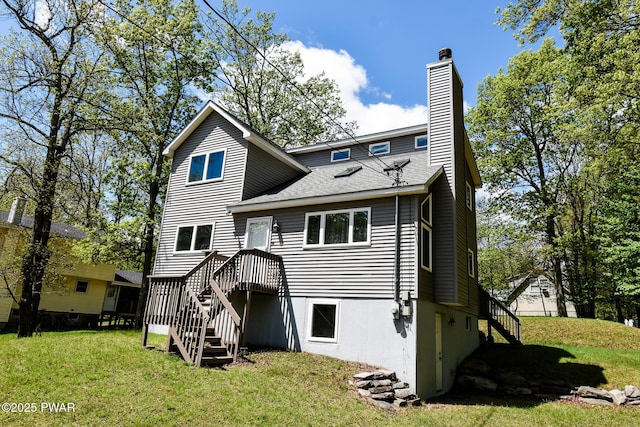 139 Westwood Dr, Dingmans Ferry, PA 18328 - rear view of house featuring stairway, a chimney, a lawn, and a shingled roof