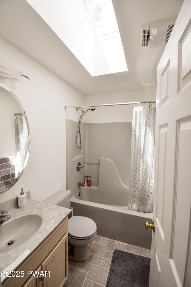139 Westwood Dr, Dingmans Ferry, PA 18328 - bathroom featuring a skylight, shower / tub combo with curtain, vanity, and toilet