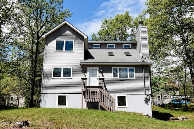139 Westwood Dr, Dingmans Ferry, PA 18328 - rear view of property featuring a yard, a chimney, and a shingled roof