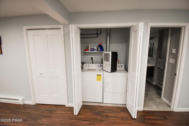 139 Westwood Dr, Dingmans Ferry, PA 18328 - laundry room with washing machine and clothes dryer, baseboard heating, a baseboard heating unit, and dark wood-style floors
