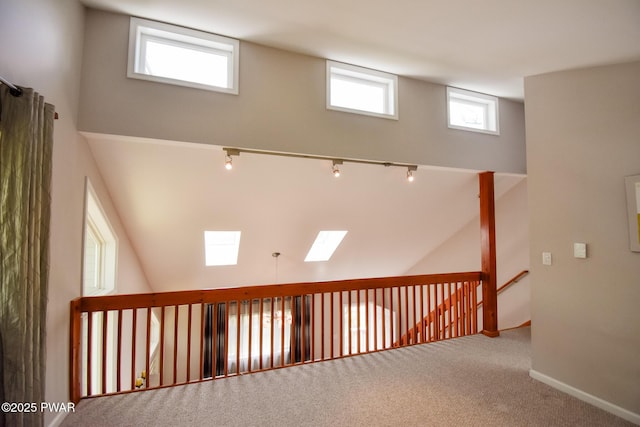 139 Westwood Dr, Dingmans Ferry, PA 18328 - hall with plenty of natural light, carpet flooring, and baseboards
