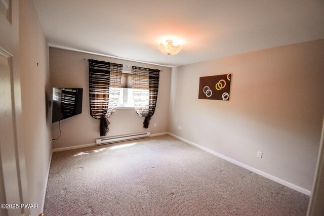 139 Westwood Dr, Dingmans Ferry, PA 18328 - unfurnished room with a baseboard heating unit, carpet floors, and baseboards