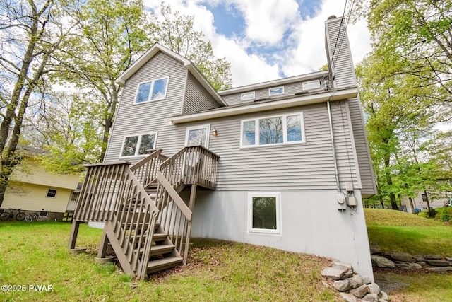 139 Westwood Dr, Dingmans Ferry, PA 18328 - rear view of house with stairs, a chimney, a deck, and a lawn