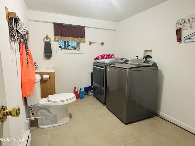 washroom with washing machine and dryer