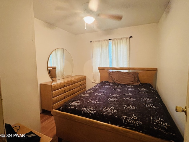 bedroom featuring ceiling fan and hardwood / wood-style floors