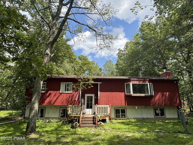 130 Roundhill Rd, Dingmans Ferry, PA 18328 - view of front facade with a chimney