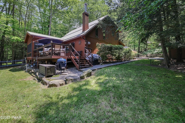 102 Lake Run, Greentown, PA 18426 - rear view of property with a chimney, a deck, a patio area, a yard, and stairway