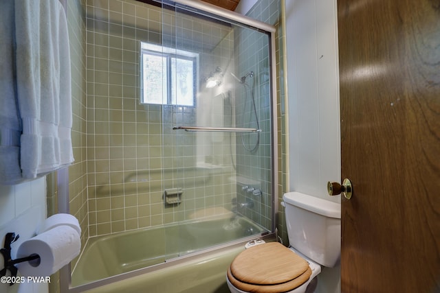 102 Lake Run, Greentown, PA 18426 - bathroom featuring toilet and bath / shower combo with glass door
