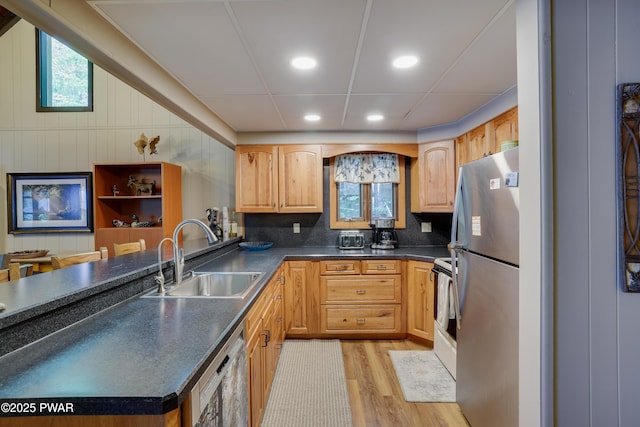102 Lake Run, Greentown, PA 18426 - kitchen with appliances with stainless steel finishes, dark countertops, light wood-style floors, healthy amount of natural light, and recessed lighting
