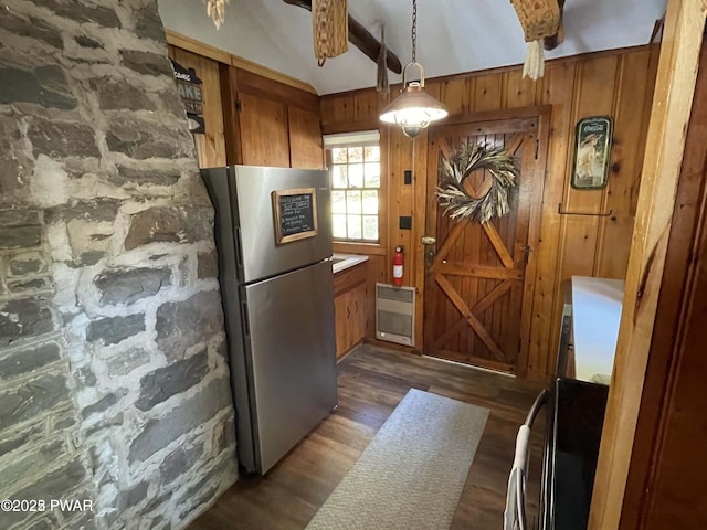 22 Glen Rd, Lake Ariel, PA 18436 - kitchen featuring freestanding refrigerator, heating unit, brown cabinets, vaulted ceiling, and dark wood-style flooring