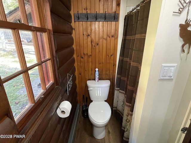 22 Glen Rd, Lake Ariel, PA 18436 - bathroom featuring wood walls, a shower with shower curtain, plenty of natural light, and wood finished floors