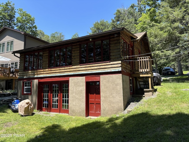 22 Glen Rd, Lake Ariel, PA 18436 - back of house featuring a lawn, french doors, and stucco siding