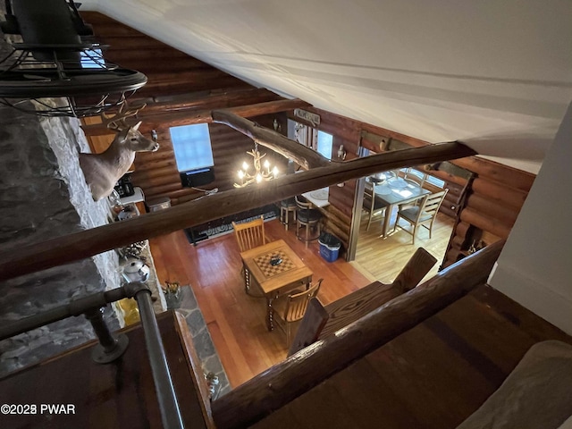 22 Glen Rd, Lake Ariel, PA 18436 - living room with rustic walls, vaulted ceiling, wood finished floors, and a chandelier