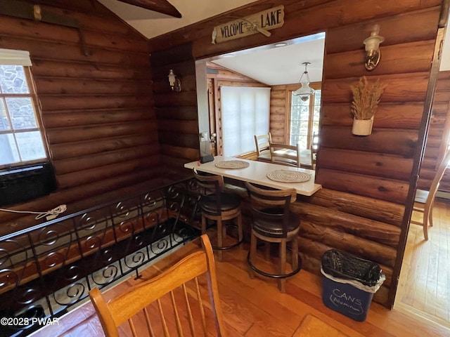 22 Glen Rd, Lake Ariel, PA 18436 - dining room with log walls, wood finished floors, plenty of natural light, and lofted ceiling