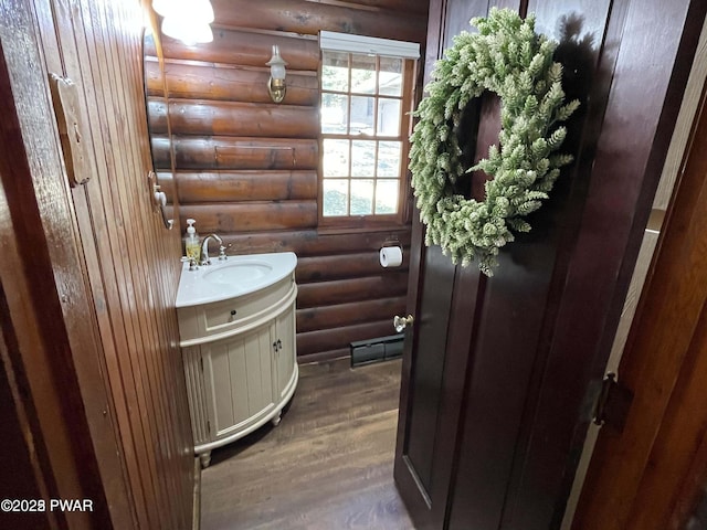 22 Glen Rd, Lake Ariel, PA 18436 - bathroom featuring rustic walls, vanity, and wood finished floors