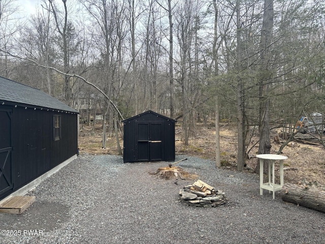 view of yard with a storage unit and an outbuilding