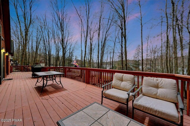 98 Roamingwood Rd, Lake Ariel, PA 18436 - deck at dusk featuring outdoor dining area