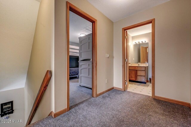 98 Roamingwood Rd, Lake Ariel, PA 18436 - hall with light colored carpet, baseboards, and an upstairs landing