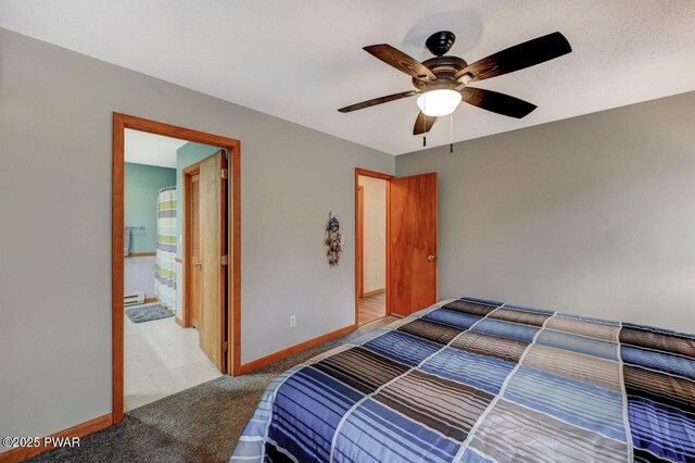 98 Roamingwood Rd, Lake Ariel, PA 18436 - carpeted bedroom featuring a baseboard heating unit, baseboards, and ceiling fan
