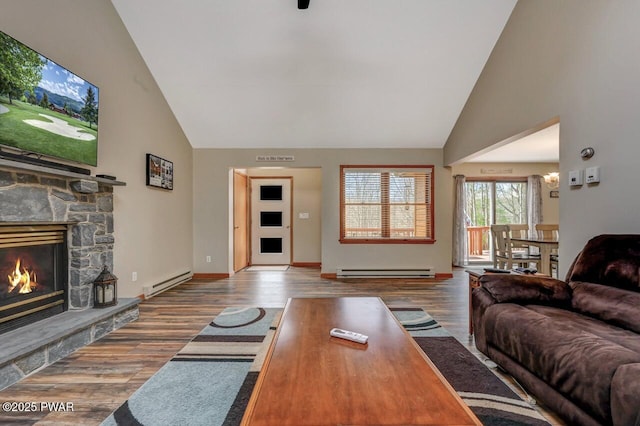 98 Roamingwood Rd, Lake Ariel, PA 18436 - living area featuring baseboard heating, wood finished floors, and high vaulted ceiling