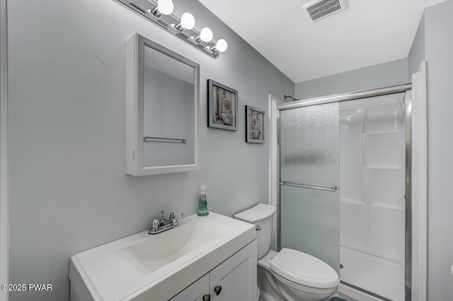 98 Roamingwood Rd, Lake Ariel, PA 18436 - bathroom featuring toilet, vanity, visible vents, and a stall shower