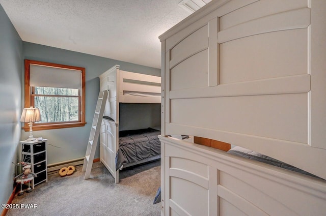 98 Roamingwood Rd, Lake Ariel, PA 18436 - bedroom with a baseboard heating unit, carpet floors, a textured ceiling, and baseboards