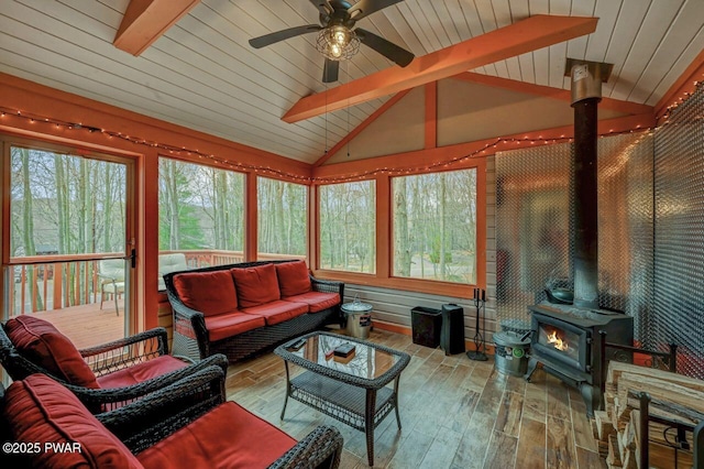 98 Roamingwood Rd, Lake Ariel, PA 18436 - living room with vaulted ceiling with beams, a ceiling fan, hardwood / wood-style floors, wooden ceiling, and a wood stove