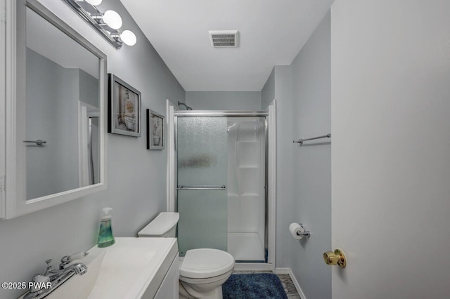 98 Roamingwood Rd, Lake Ariel, PA 18436 - bathroom with a shower stall, visible vents, toilet, vanity, and baseboards