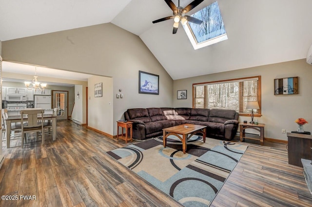 98 Roamingwood Rd, Lake Ariel, PA 18436 - living area with dark wood finished floors, baseboards, ceiling fan with notable chandelier, a skylight, and high vaulted ceiling